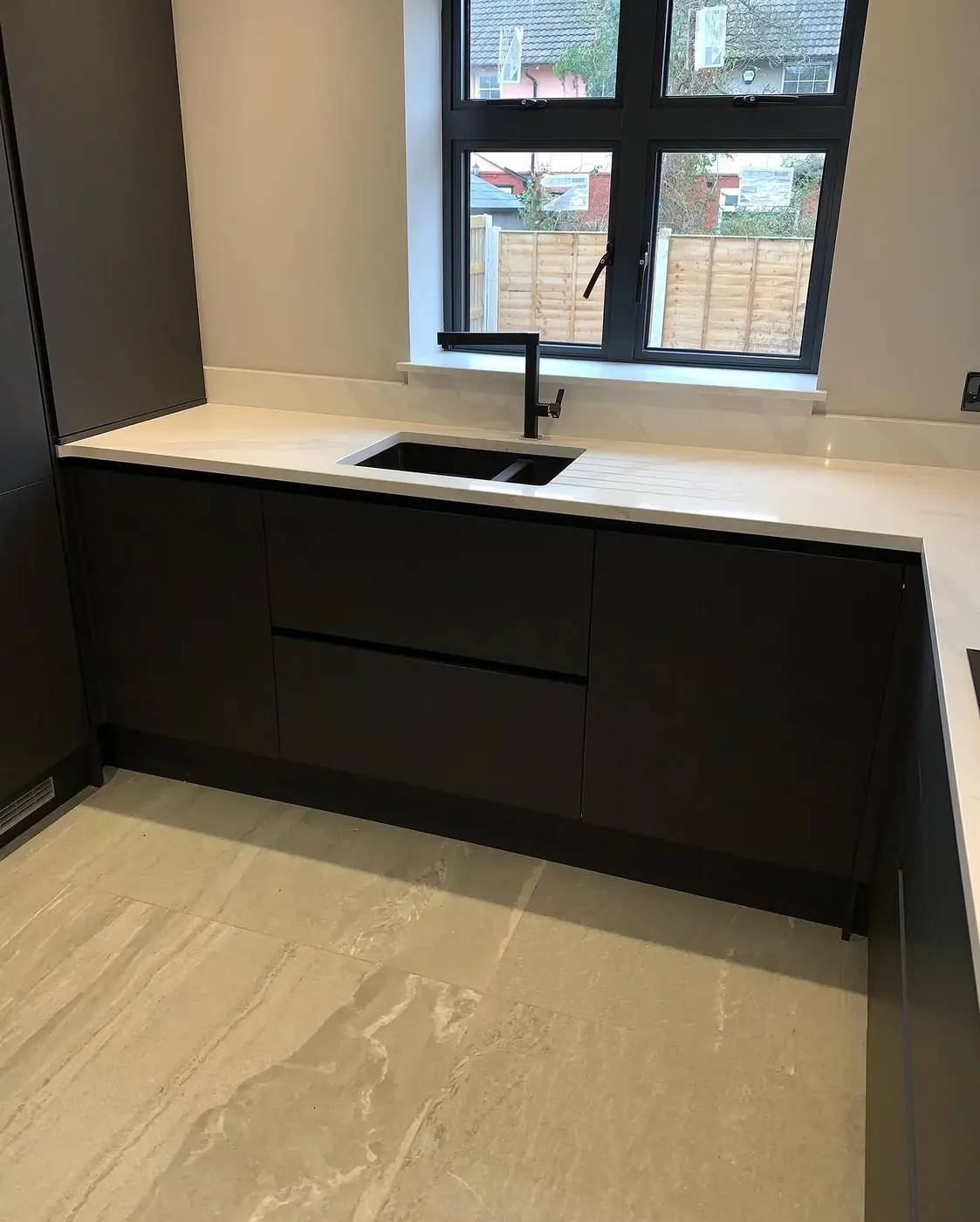 Black handleless sink run with undermount sink and black tap